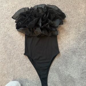 Woman’s Black Ruffle body suit.